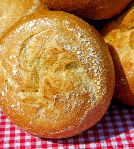 bread on red and white checkered textile